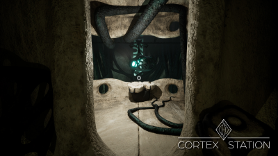 Screenshot from the vertical slice, depicting an alien control terminal with a suspended gondola in the background within the caves.